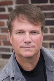 Mark Armstrong as NY Times Reporter