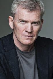 Richard Dillane as Acting Commissioner