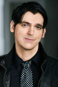 Evan King as Iron City Resident
