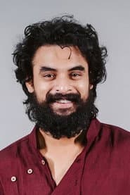 Tovino Thomas as Krishnan Pillai (Pothan Christopher / Pallichattambi)