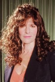 Elaine Corral Kendall as Newscaster (uncredited)