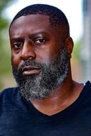 Derrick Goodman Jr. as Potluck Dinner Attendee