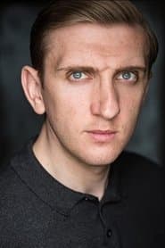 Philip Shaun McGuinness as Elevator Guard