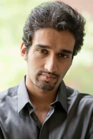 Ronny Mathew as Liquor Store Clerk