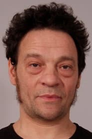 Christian Dunkley-Clark as Hospital Orderly / Raving Maniac