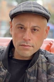 Evan Shafran as Travel Passenger (uncredited)