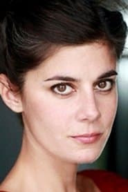 Sara-Jeanne Drillaud as AAV Secretary