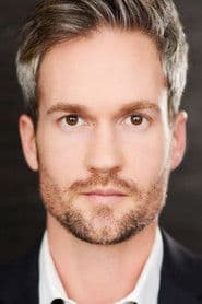 Kyle David Pierce as Gotham Stock Trader (uncredited)
