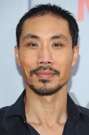 Tom Wu as Bhutanese Prison Guard #1