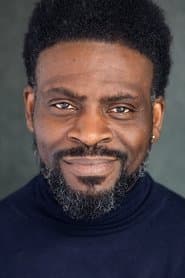 Emeson Nwolie as Man in Street (uncredited)