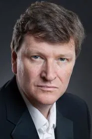 Jonathan Keeble as Pathé Newsreader (voice)