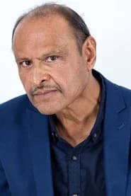 Jag Patel as Mourner (uncredited)