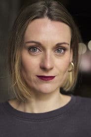 Emma Hartley-Miller as Woman on Train