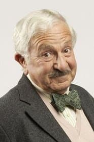 John Bluthal as Professor Pacoli