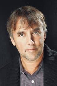 Richard Linklater as Man in Shonen Knife T-Shirt Playing Foosball (uncredited)