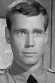 John Kelland as Officer at Officer’s Club (Uncredited)