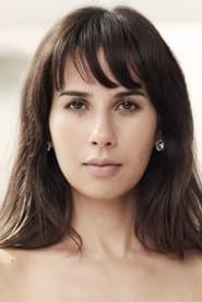 Zineb Oukach as Hostess on The Naomi