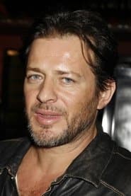 Costas Mandylor as Interpol Regional Chief Henry