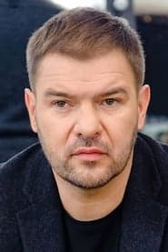 Tomasz Karolak as School Principal (archive footage) (uncredited)