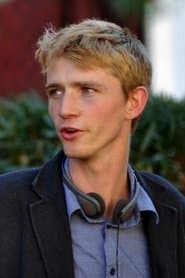 Luke Eberl as Arcade Guy (uncredited)
