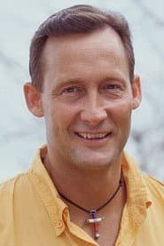John Raymond as Pastor