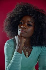 Winnie Ama as Evely Band Singer
