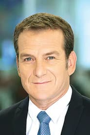 Danny Kushmaro as Channel 2 News Anchor