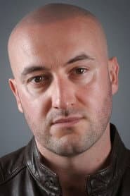 Alex Ballesteros as Bikie (uncredited)