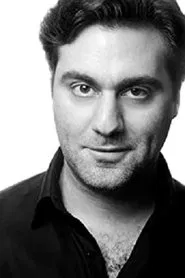 Sargon Yelda as Businessman