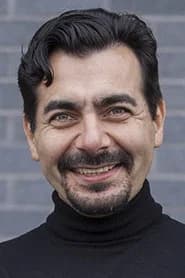 Oleg Hill as EU Ambassador (uncredited)