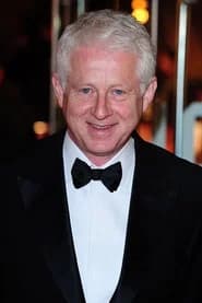 Richard Curtis as Bicycle Courier (uncredited)