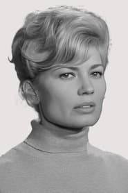 Nadia Sanders as Nadine, the Hostess