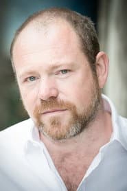 Dominic Kinnaird as Suited Man