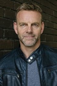 Richard Laing as Arkham Chase Cop