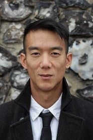 Mark Chiu as Bhutanese Prison Guard #2