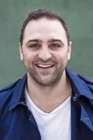 Michael Kotsohilis as Newsstand Vendor