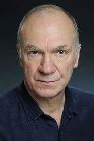 Derek Hutchinson as Bureaucrat