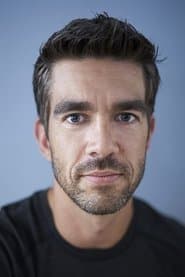 Daniel Stevens as Armed Guard