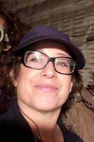 Ingrid K. Behrens as Female Voice in Porn Film (voice) (uncredited)