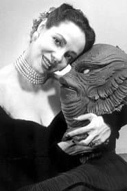 Milicent Patrick as Extra in Dress Circle (uncredited)