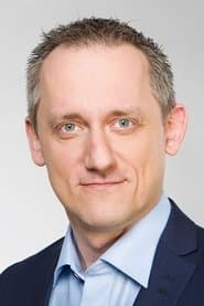 Michal Kubal as Czech TV News Anchor (uncredited)