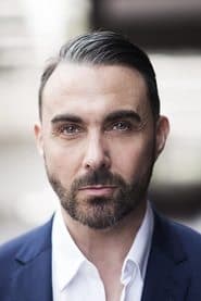 Jonathan D. Ellis as Courthouse Reporter #2