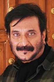 Milind Gunaji as Priest