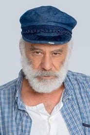 Yannis Kokiasmenos as Old Man at Coastal Village