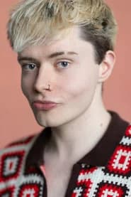 Joe Henry-Evans as Student Dom