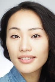 Mina Kweon as Korean Train Passenger